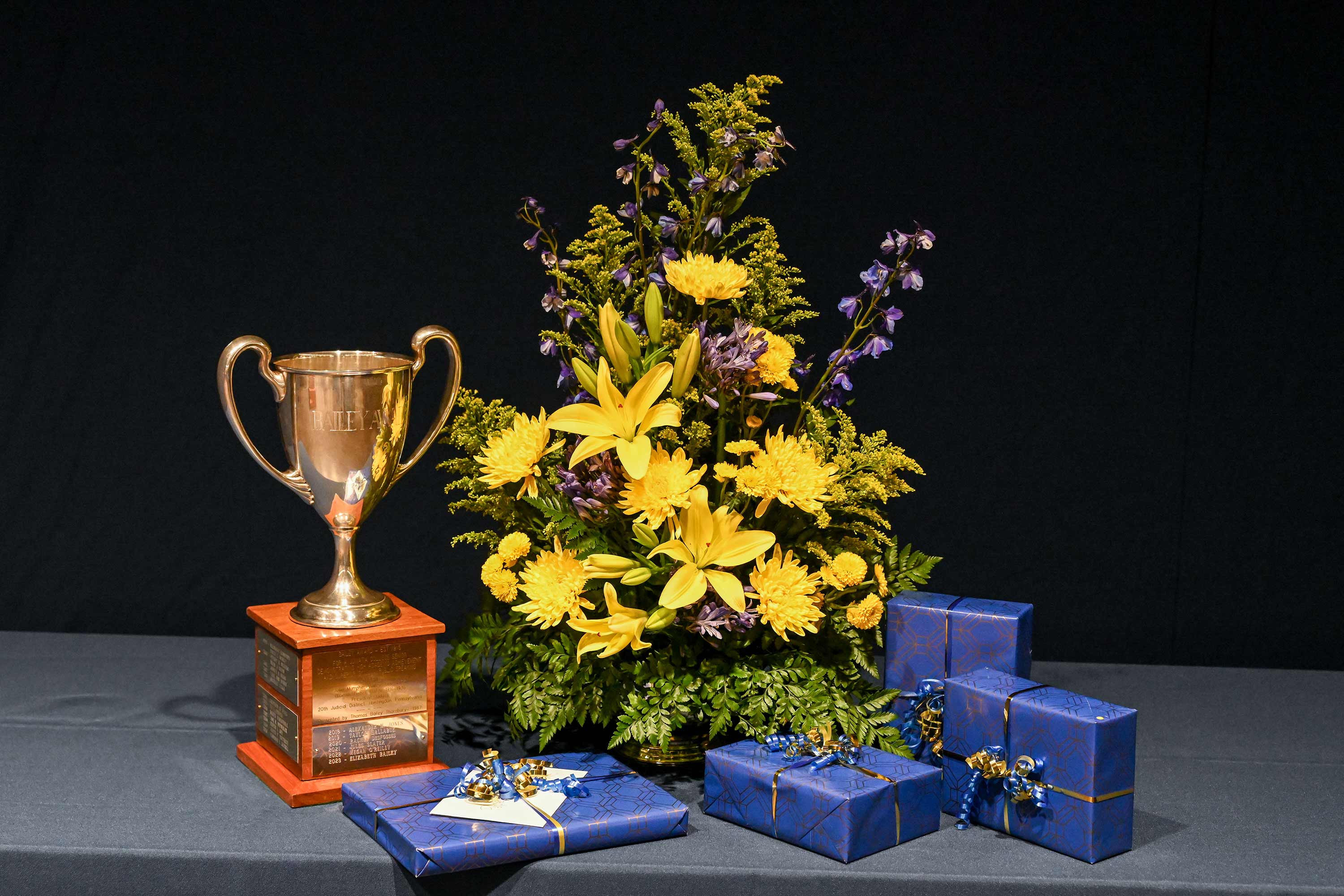 photo of the Loving Cup Bailey Oratorical award with flowers