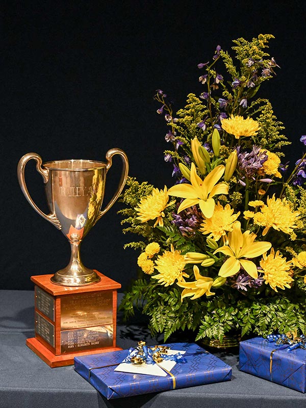 photo of the Loving Cup Bailey Oratorical award with flowers